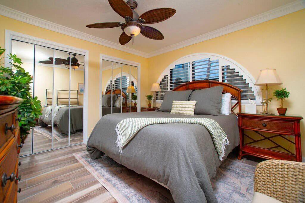 a bedroom with a bed and a ceiling fan at Lime Tree Bay Unit # 40 in West Bay