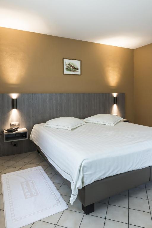 Postel nebo postele na pokoji v ubytování Hotel In den Bonten Os