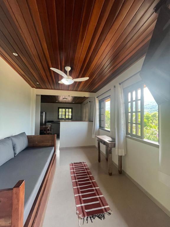 a living room with a couch and a ceiling at BEAUTIFUL VIEW in Angra dos Reis