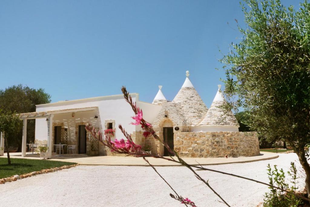 a building with turrets on the side of it at Residence Spadalunga in San Michele Salentino