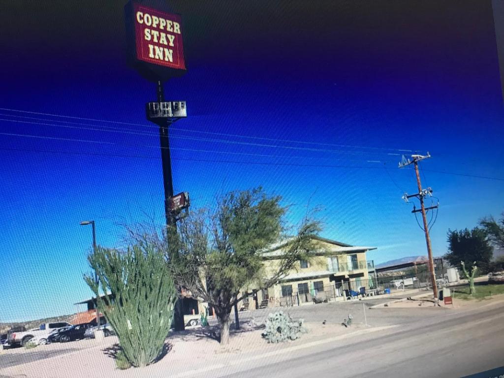 a street sign on a pole on the side of a street at COPPER STAY INN Benson AZ I-10 Exit 304 in Benson