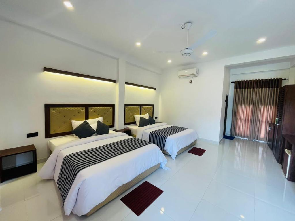 Postel nebo postele na pokoji v ubytování Four Points Resort - Anuradhapura