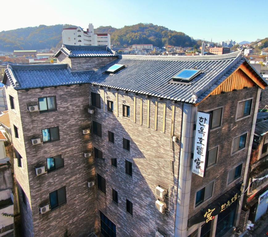 an overhead view of a building with solar panels on the roof at Jeonju Hanok Hotel Kung in Jeonju