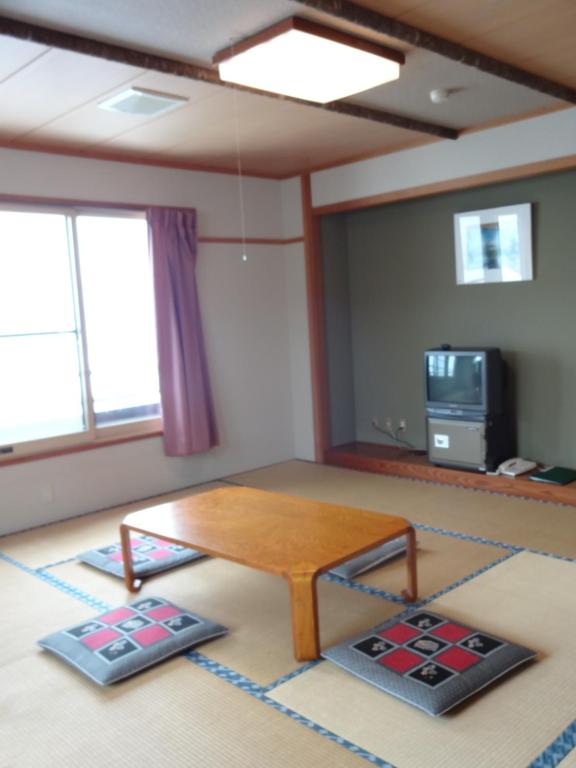 TV a/nebo společenská místnost v ubytování Highland Lodge Takegen
