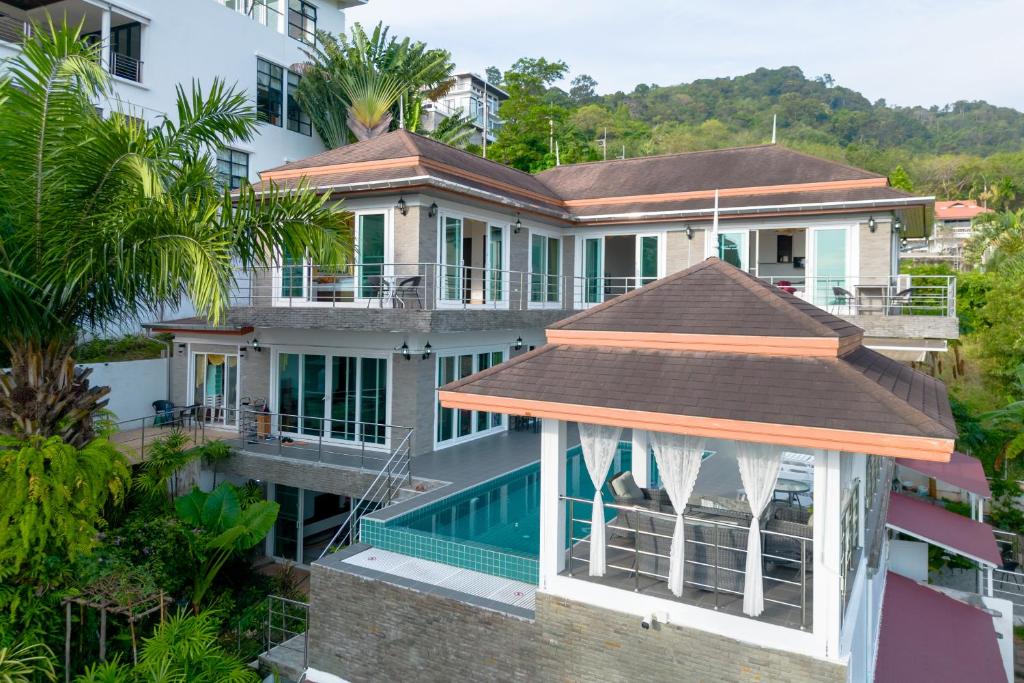 an aerial view of a house with a swimming pool at ฺBaan Waru seaview villa in Ban Kata