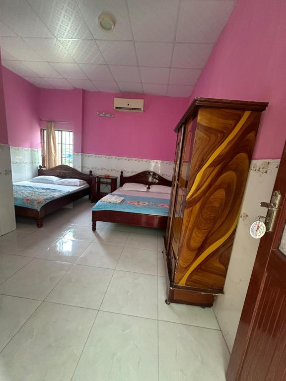 Säng eller sängar i ett rum på San Vuon Guesthouse