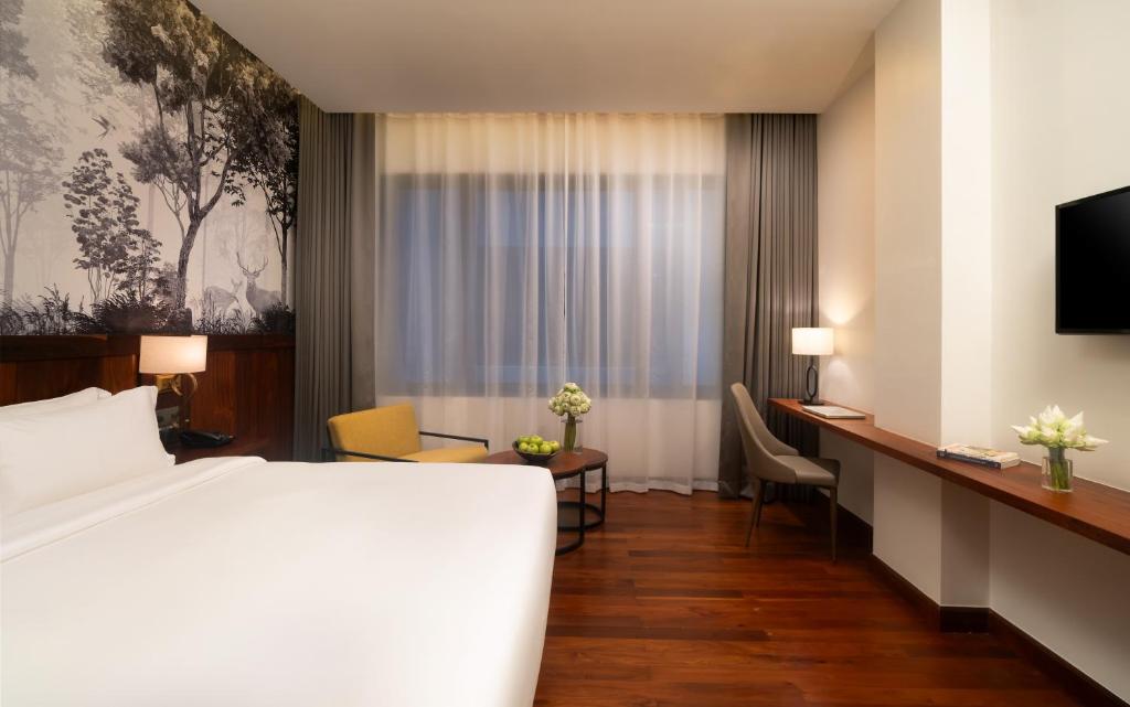 Postel nebo postele na pokoji v ubytování Koulen Central Hotel