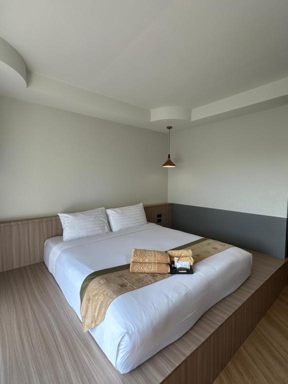 Postel nebo postele na pokoji v ubytování Diamond Park Inn Chiangrai & Resort