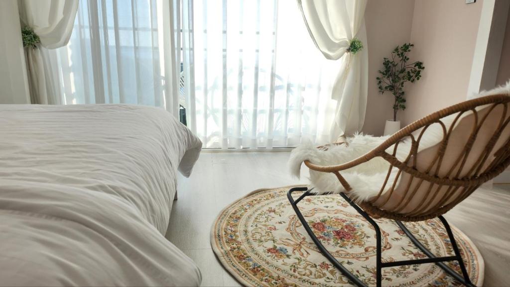 Postel nebo postele na pokoji v ubytování Pension Haneul Tari