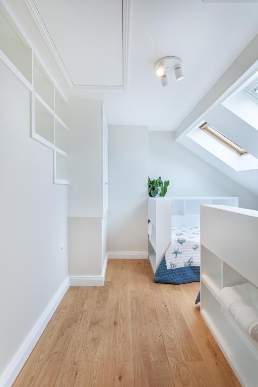 Postel nebo postele na pokoji v ubytování Les appartements de Chantilly - gare