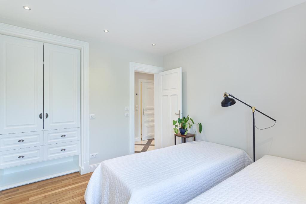 Postel nebo postele na pokoji v ubytování Les appartements de Chantilly - gare