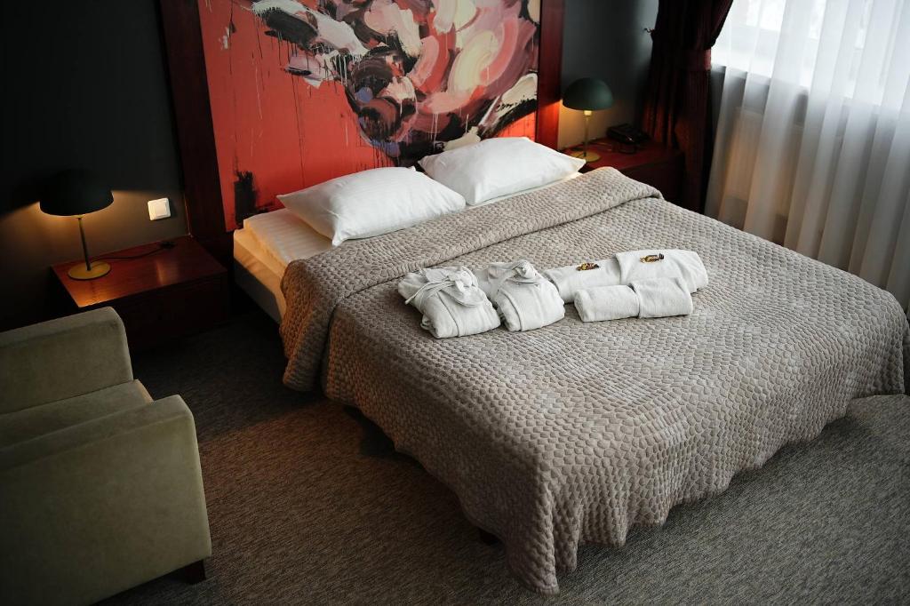 Postel nebo postele na pokoji v ubytování Hotel Navalis, Klaipėda