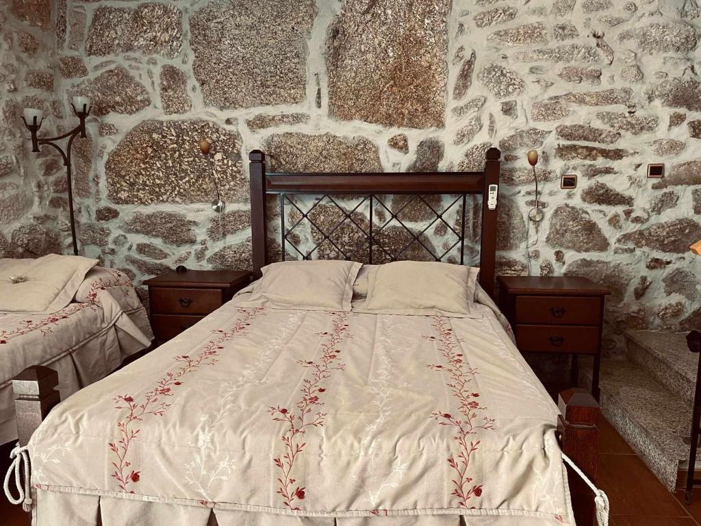 Uma cama ou camas num quarto em Quinta Do Moinho Turismo de Natureza