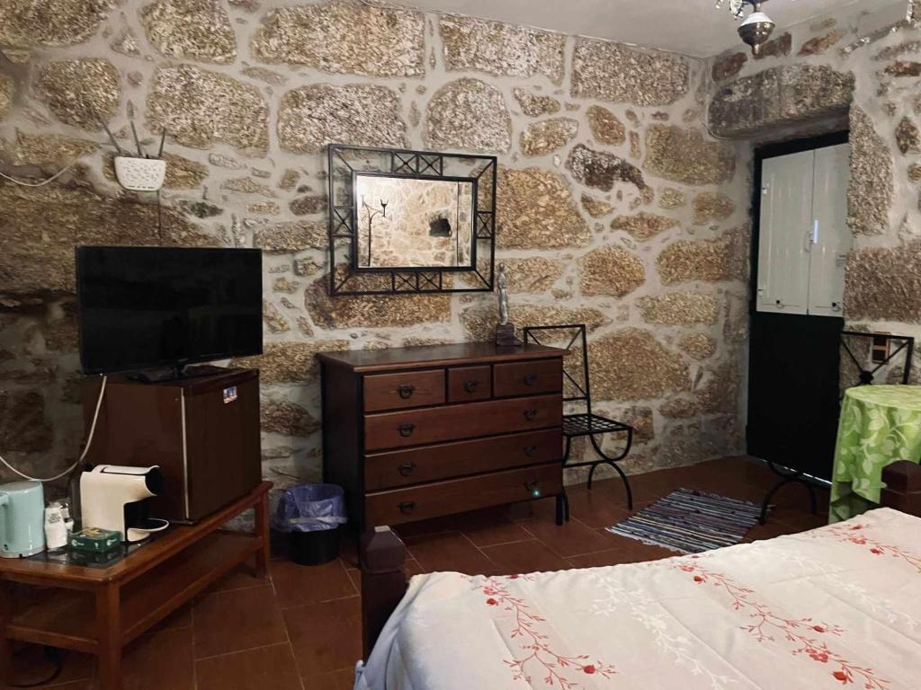 Uma cama ou camas num quarto em Quinta Do Moinho Turismo de Natureza