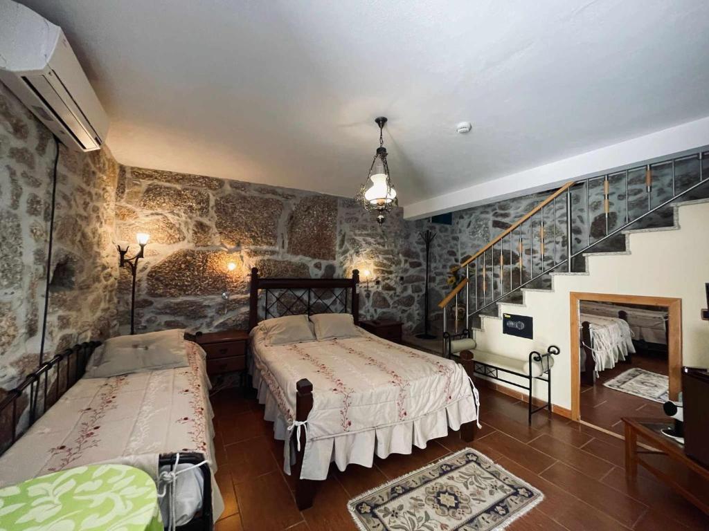 Uma cama ou camas num quarto em Quinta Do Moinho Turismo de Natureza