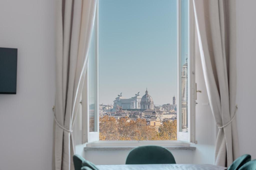a window with a view of the city at The Attico: best view of Rome in Rome