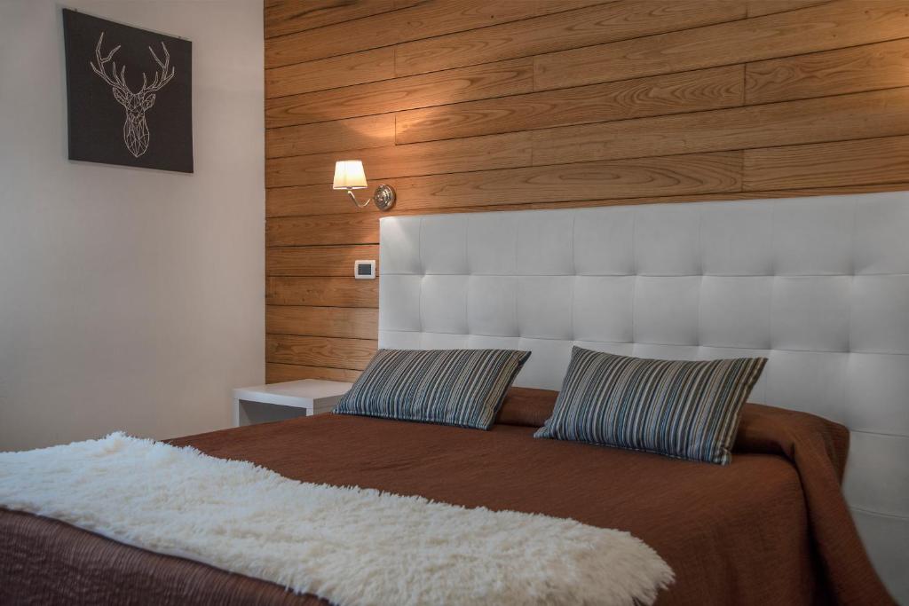 Postel nebo postele na pokoji v ubytování Piccolo Hotel Aurora