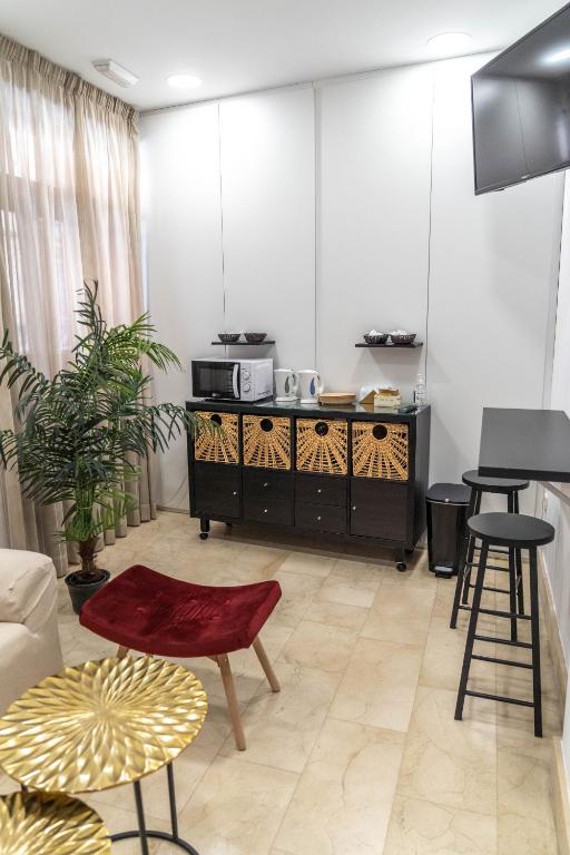 TV a/nebo společenská místnost v ubytování Hotel Granada Centro