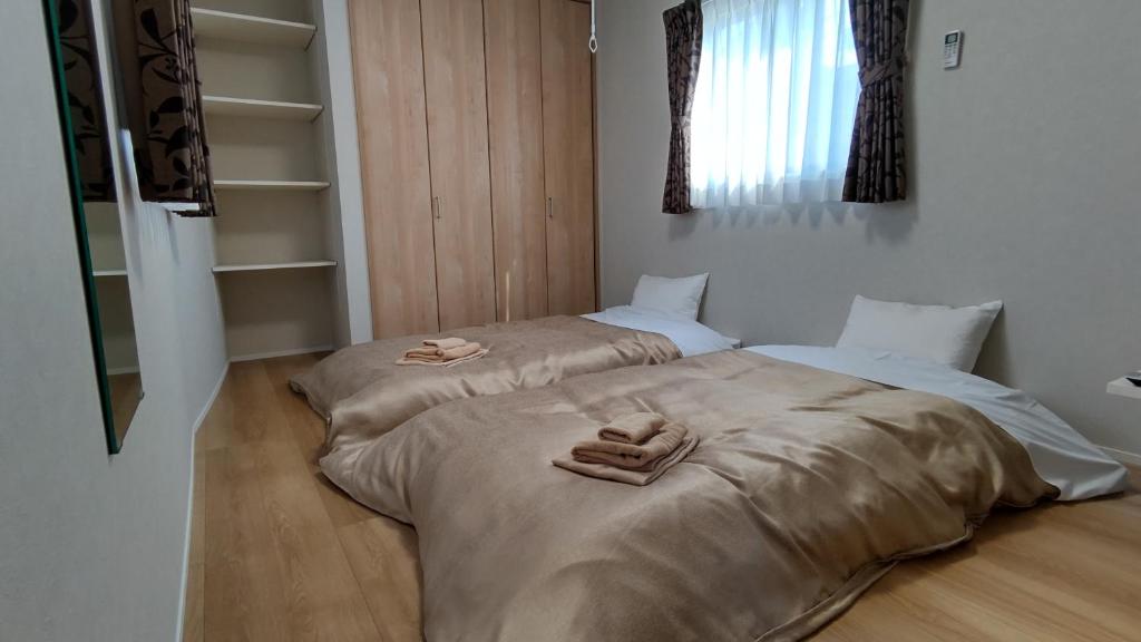 Postel nebo postele na pokoji v ubytování Basic Hotel Chichibu