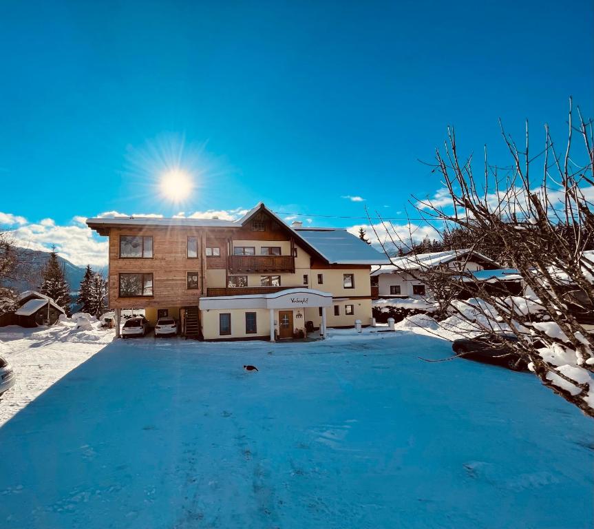 a house with a lot of snow in front of it at Vorberghof in Ramsau am Dachstein