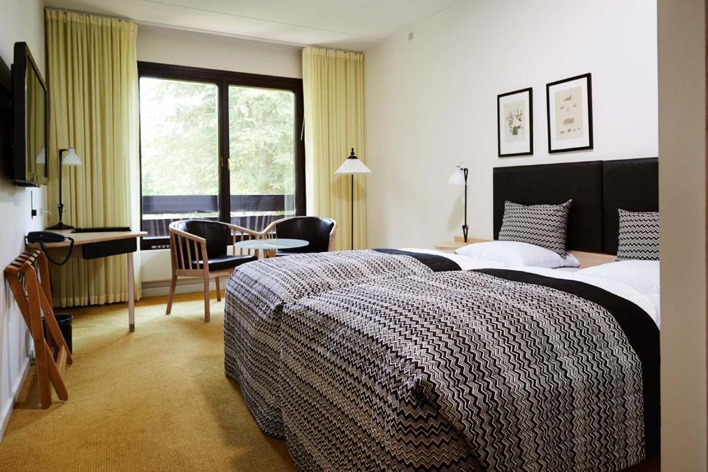 Postel nebo postele na pokoji v ubytování Munkebjerg Hotel