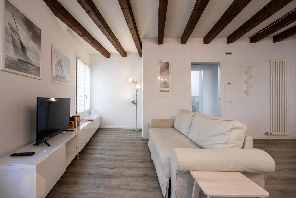 A television and/or entertainment centre at San Faustino Central Apartment