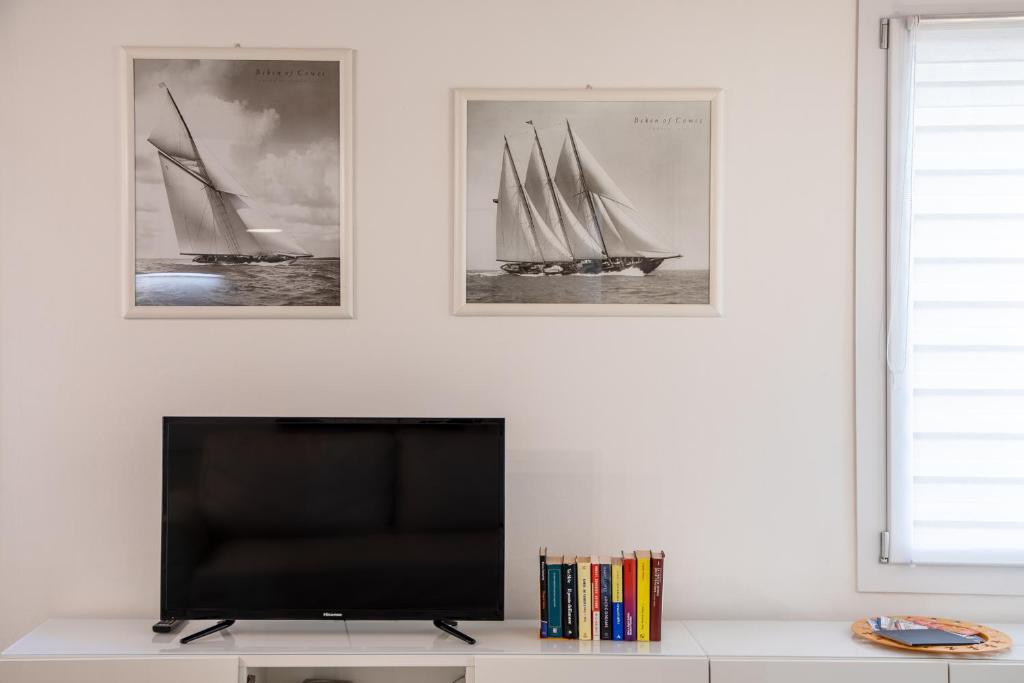 A television and/or entertainment centre at San Faustino Central Apartment