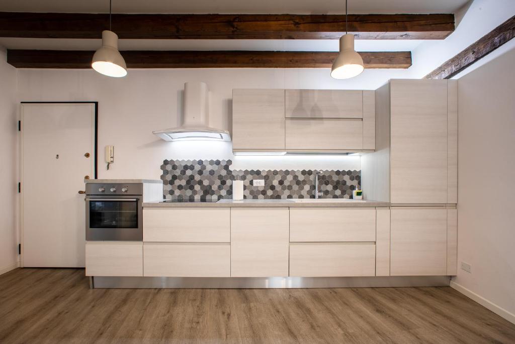 A kitchen or kitchenette at San Faustino Central Apartment