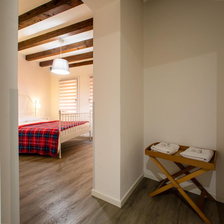 A bed or beds in a room at San Faustino Central Apartment