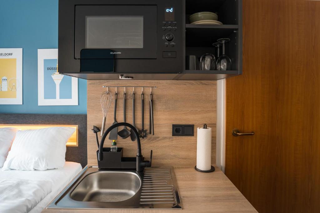 Antares Apartmentsにあるキッチンまたは簡易キッチン