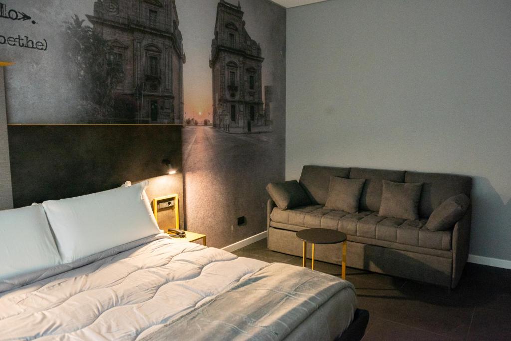 Postel nebo postele na pokoji v ubytování Alma Hotel