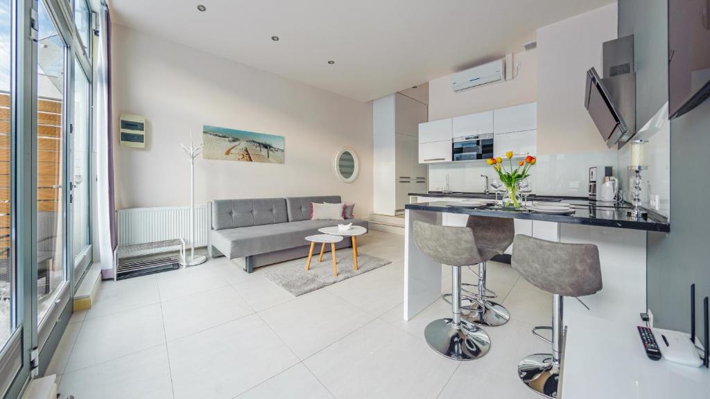 TV a/nebo společenská místnost v ubytování Apartamenty Sun & Snow Międzyzdrojski Rynek