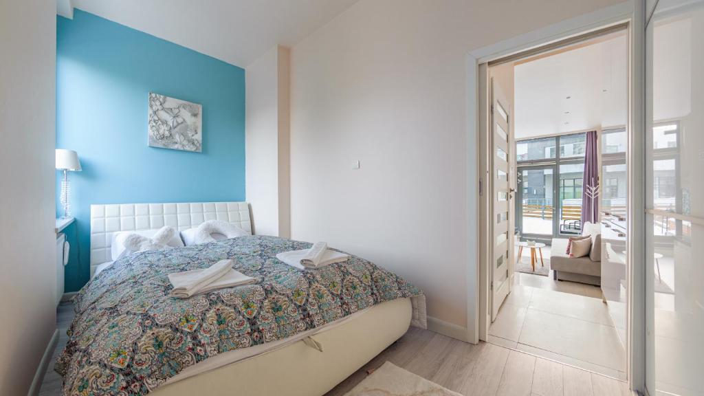 Postel nebo postele na pokoji v ubytování Apartamenty Sun & Snow Międzyzdrojski Rynek