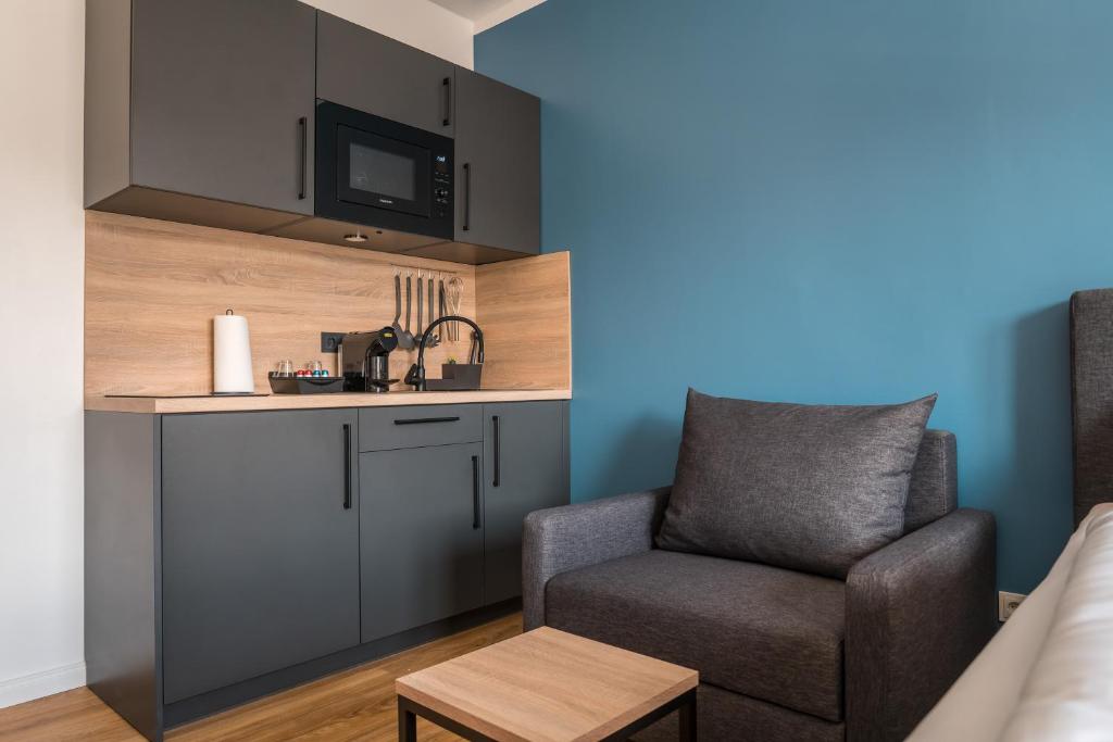 Antares Apartmentsにあるキッチンまたは簡易キッチン