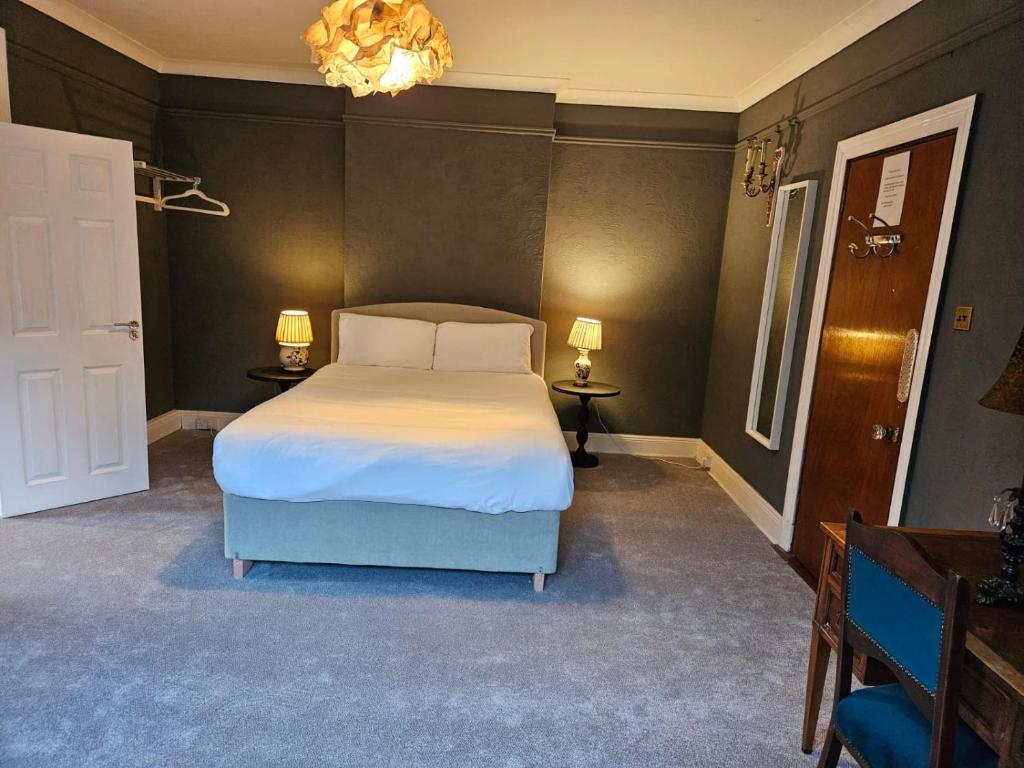 Postel nebo postele na pokoji v ubytování Boutique Guest House