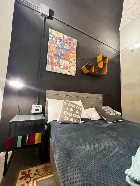 Postel nebo postele na pokoji v ubytování Urban Suite