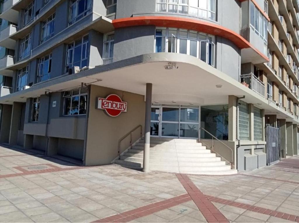 a building with a cocacola sign on the side of it at Tenbury by the beachfront 806 in Durban