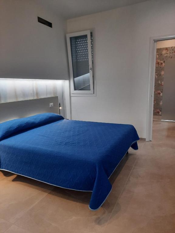 Postel nebo postele na pokoji v ubytování Azzurro Mare Aparthotel
