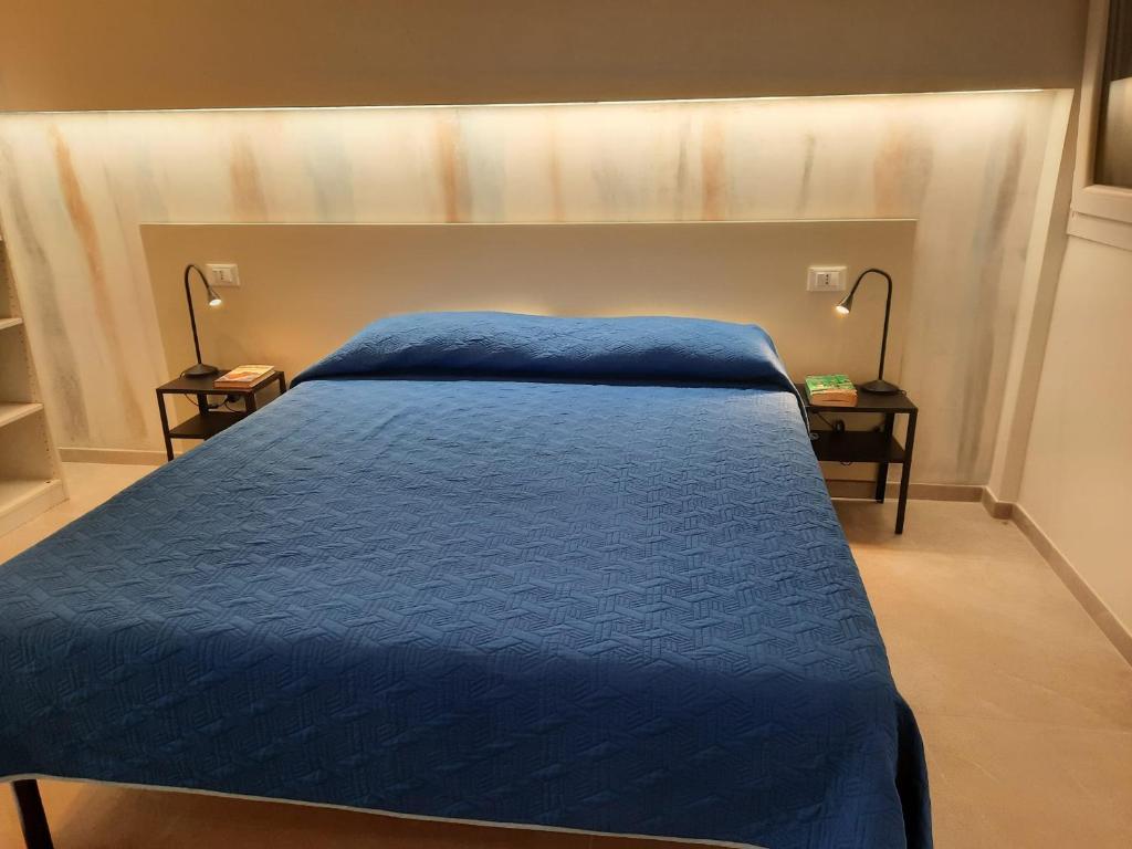 Postel nebo postele na pokoji v ubytování Azzurro Mare Aparthotel