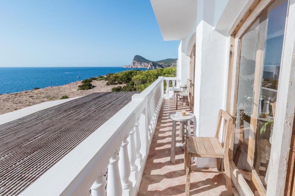 a balcony of a house with a view of the ocean at Hostal La Torre Ibiza Cap Negret in San Antonio