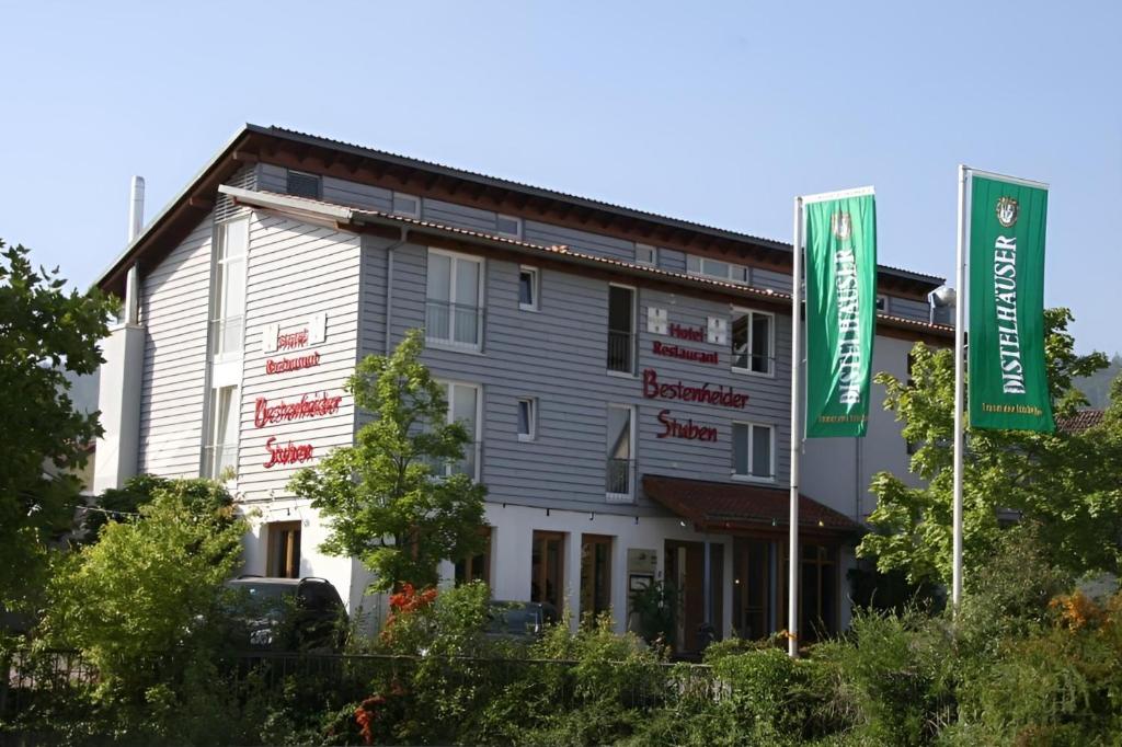 a large building with signs in front of it at Hotel & Restaurant Bestenheider Stuben in Wertheim