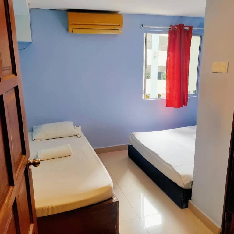Postel nebo postele na pokoji v ubytování RAS Hotel