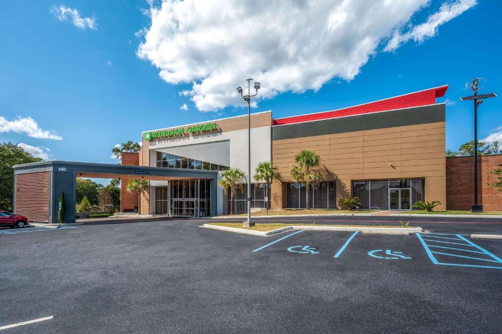 a building with a parking lot in front of it at Wyndham Garden Columbia-Ft Jackson in Columbia