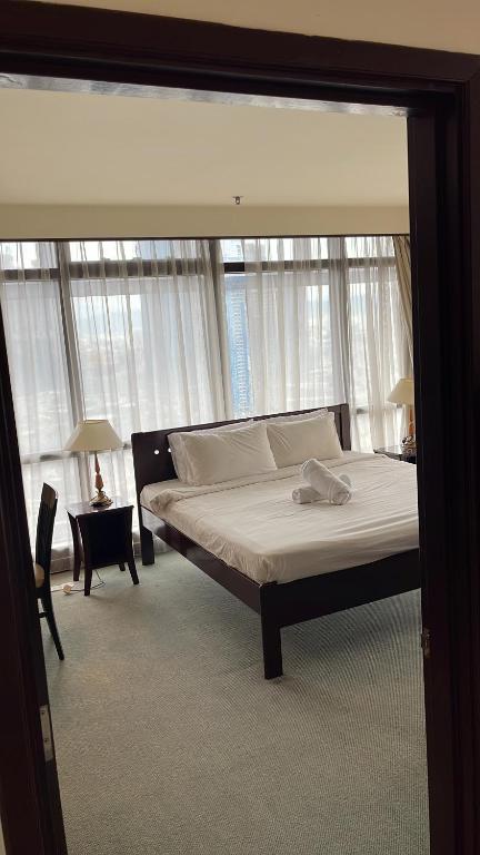 Postel nebo postele na pokoji v ubytování RESORT SUITES AT BARJAYA TIMES SQUARE kL