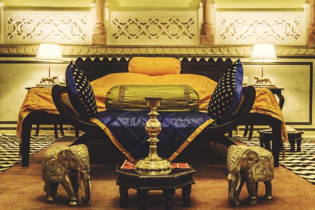 a bedroom with a bed with a trophy in it at The Umaid Vilas Royal Heritage Haveli in Jaipur