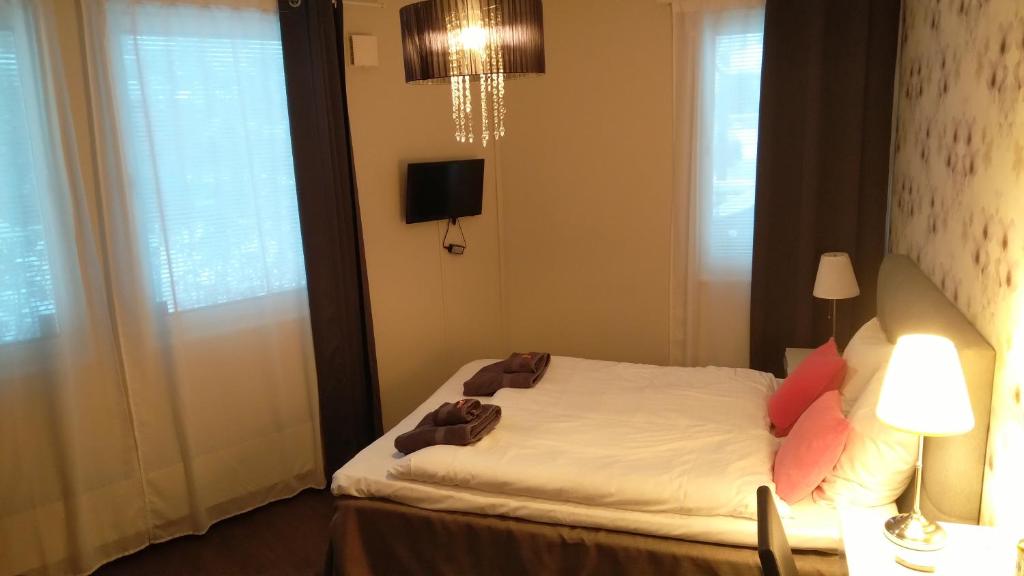 Postel nebo postele na pokoji v ubytování Hotel Charlotte / Stella