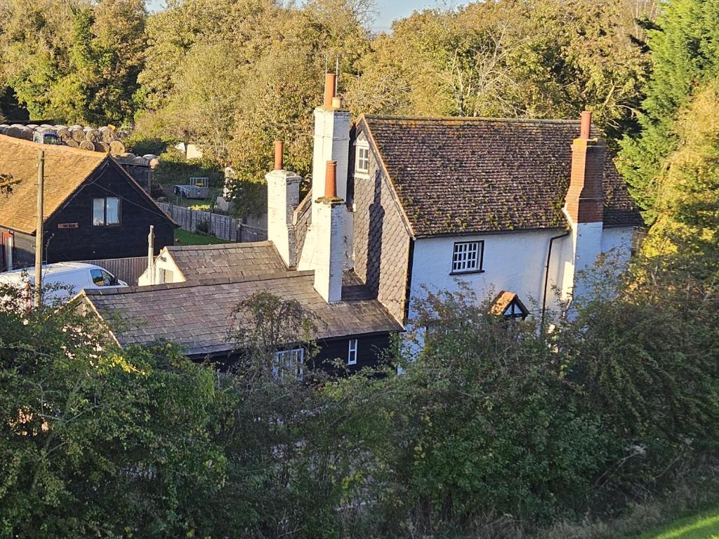 an overhead view of a house with a roof at Startop Farmhouse in Marsworth