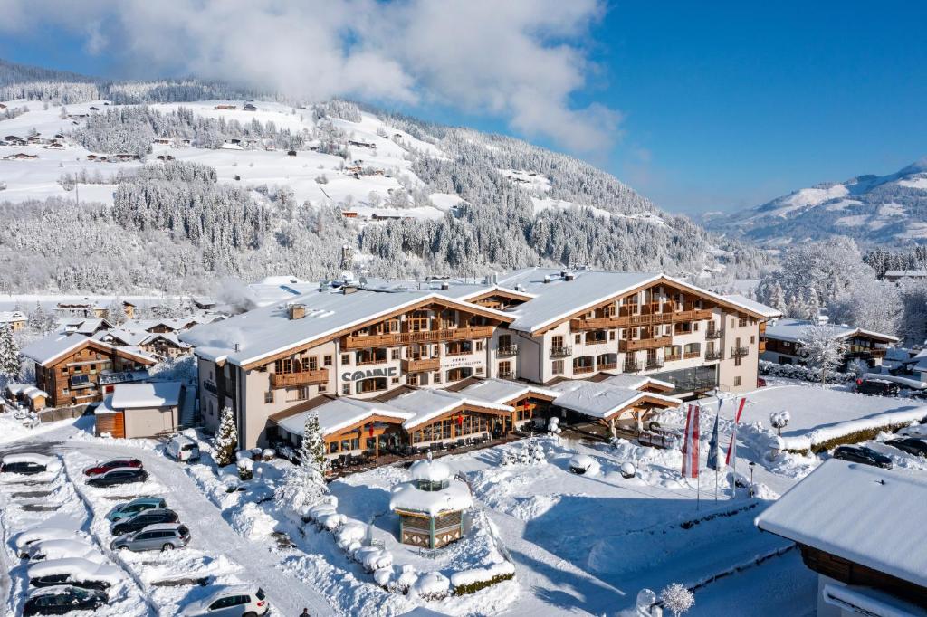 an aerial view of a resort in the snow at Hotel & Spa Sonne 4 Sterne Superior in Kirchberg in Tirol