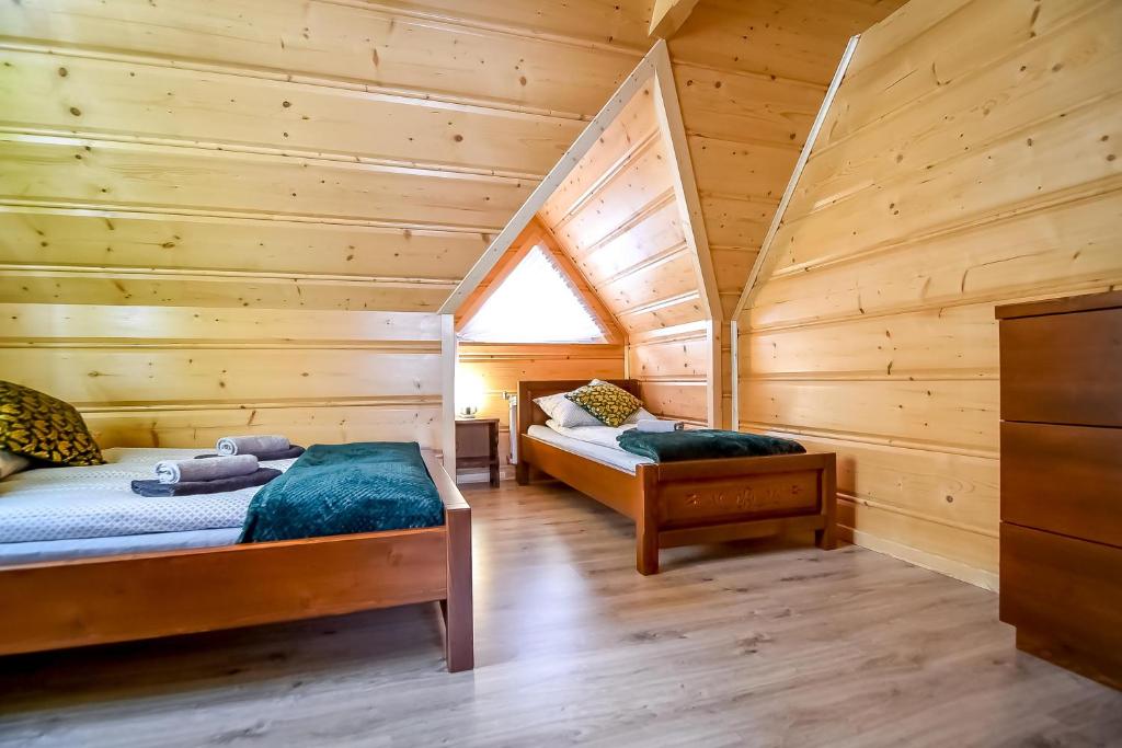 Postel nebo postele na pokoji v ubytování Domki u Jasia