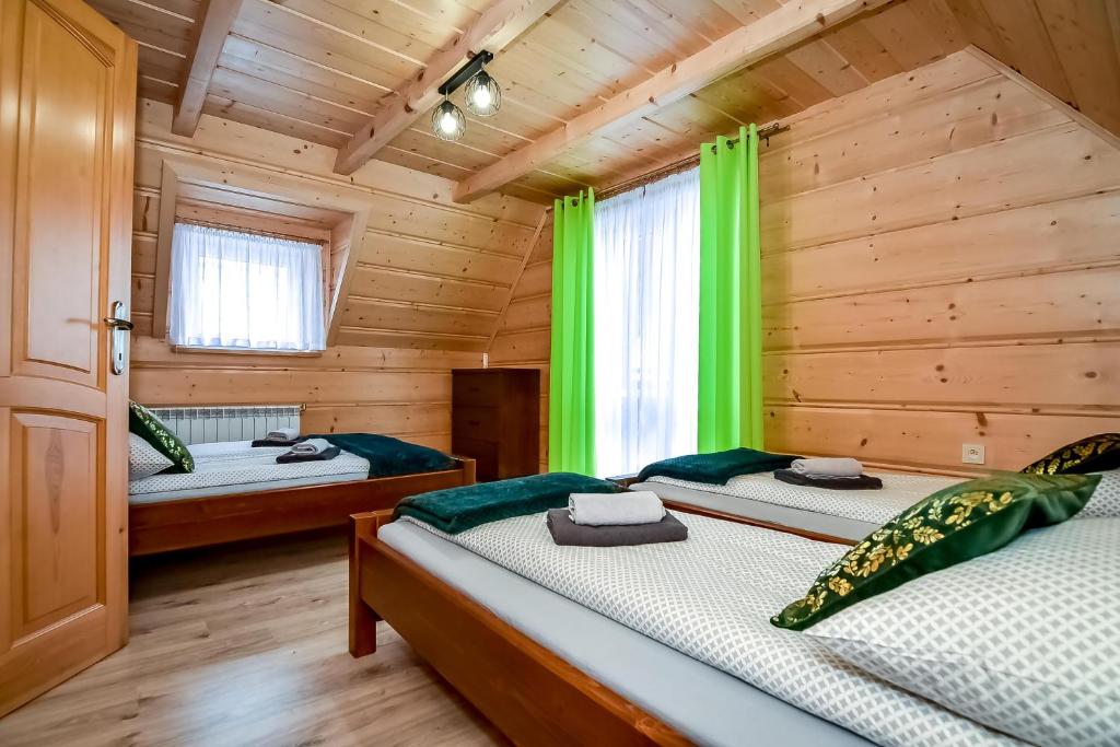 Postel nebo postele na pokoji v ubytování Domki u Jasia